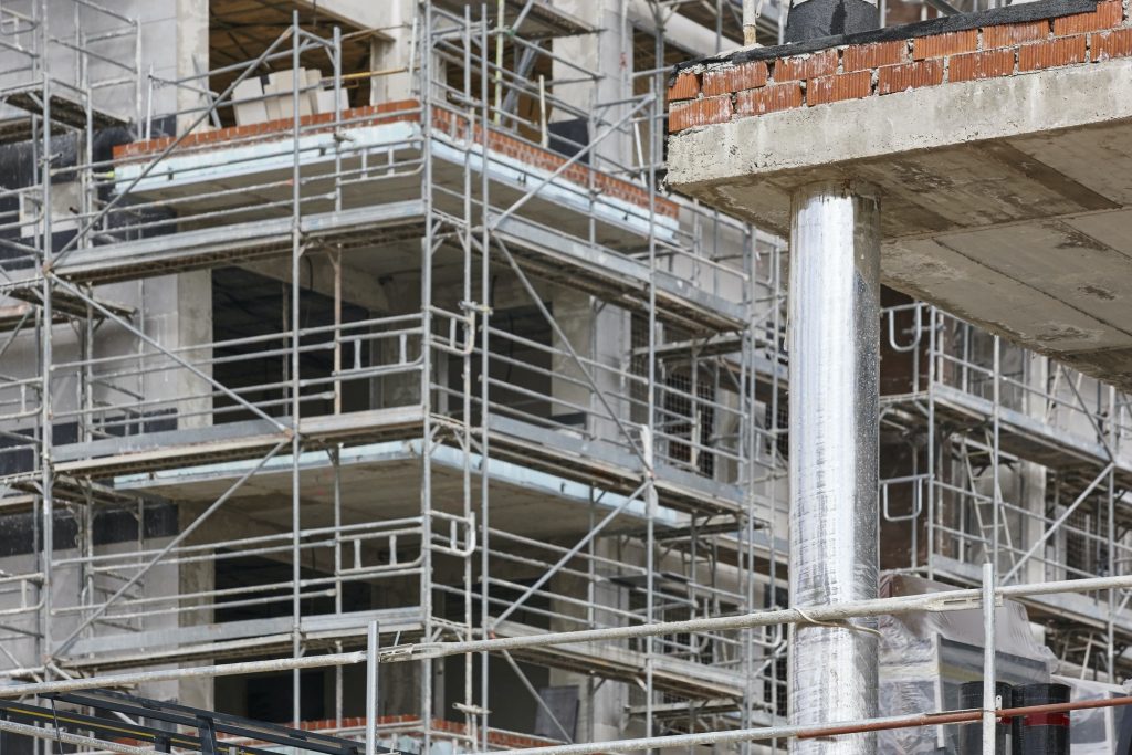 Building facade under construction. Concrete structure. Architecture. Horizontal